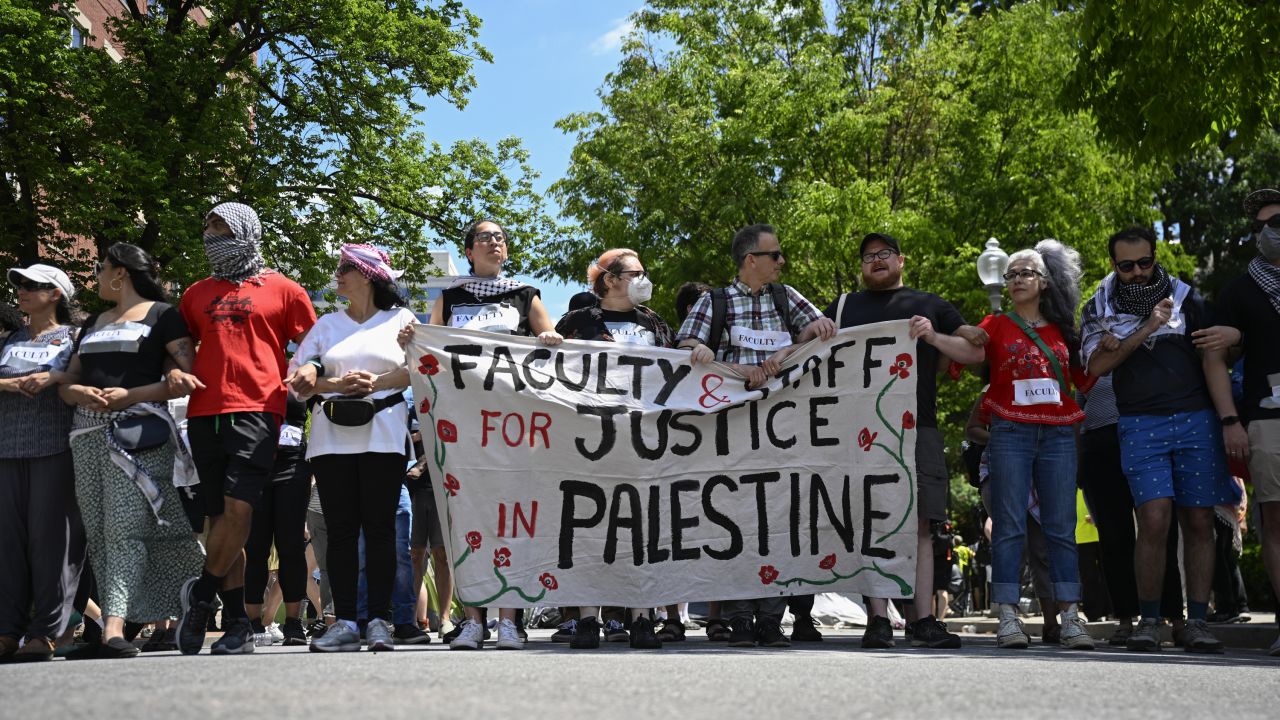 WASHINGTON DC, UNITED STATES - MAY 02: Students hold banners as they continue pro-Palestinian demonstrations at George Washington University in Washington DC, United States on May 02, 2024. (Photo by Celal Gunes/Anadolu via Getty Images)