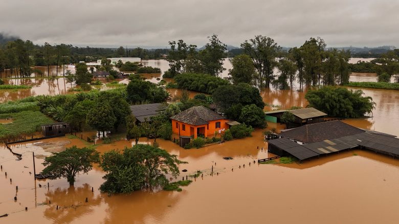 Aerial view shows a flooded area of Capela de Santana, Rio Grande do Sul state, Brazil, on May 2, 2024. Brazilian President Luiz Inacio Lula da Silva on Thursday visited the country's south where floods and mudslides caused by torrential rains have killed 13 people, with the toll likely to rise. Authorities in Rio Grande do Sul have declared a state of emergency, as rescuers continue to search for some 21 people reported missing among the ruins of collapsed homes, bridges and roads.