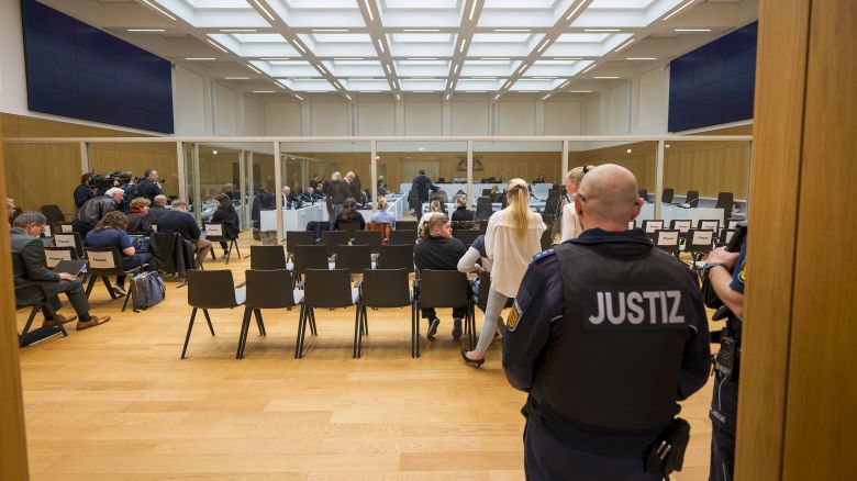 A judicial officer waits for the beginning of a landmark trial on April 29, in Stuttgart, Germany. Nine men are accused of a far-right plot to depose the country's goverment.
