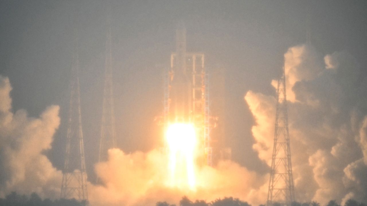 A Long March 5 rocket, carrying the Chang'e-6 mission lunar probe, lifts off as it rains at the Wenchang Space Launch Centre in southern China's Hainan Province on May 3, 2024. China is set on May 3 to launch a probe to collect samples from the far side of the Moon, a world first as Beijing pushes ahead with an ambitious programme that aims to send a crewed lunar mission by 2030.
