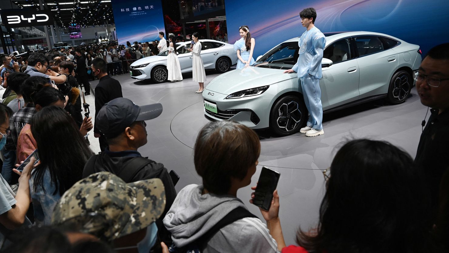 Crowds gather to view BYD electric cars at the Beijing Auto Show on May 3, 2024.