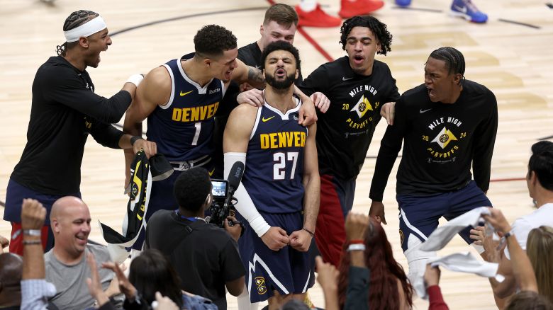 DENVER, COLORADO - APRIL 29: Jamal Murray #27 of the Denver Nuggets celebrates with his teammates after making a basket in the final seconds tom defeat the Los Angeles Lakers during game five of the Western Conference First Round Playoffs at Ball Arena on April 29, 2024 in Denver, Colorado. NOTE TO USER: User expressly acknowledges and agrees that, by downloading and or using this photograph, User is consenting to the terms and conditions of the Getty Images License Agreement. (Photo by Matthew Stockman/Getty Images)