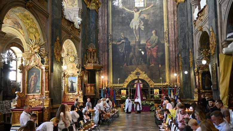 Ukrainians attend a service on the eve of Orthodox Easter at the Saints Peter and Paul Garrison Church in Lviv, Ukraine on May 4, 2024.