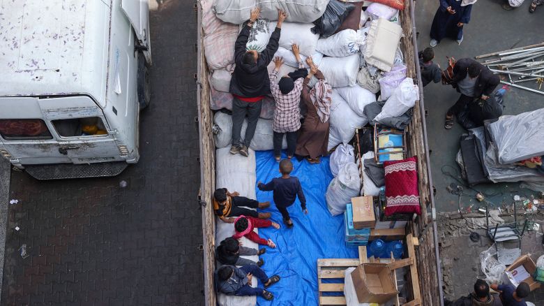 Palestinians in Rafah pack belongings into a truck after Israel's evacuation order, May 6, 2024.