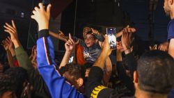 TOPSHOT - Palestinians celebrate in a street in Rafah, in the southern Gaza Strip, after Hamas announced it has accepted a truce proposal on May 6, 2024, amid the ongoing conflict between Israel and the Palestinian militant group Hamas. Hamas leader Ismail Haniyeh on May 6, informed mediators Qatar and Egypt that his Palestinian militant group had accepted their proposal for a ceasefire in Gaza after nearly seven months of war. (Photo by AFP) (Photo by -/AFP via Getty Images)