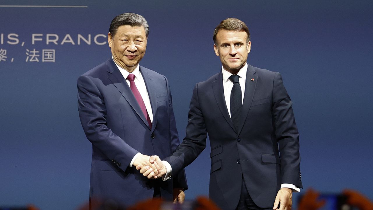 France's President Emmanuel Macron (R) and China's President Xi Jinping shake hands as they conclude their attendance at the sixth meeting of the Franco-Chinese Business Council at The Marigny Theatre in Paris on May 6, 2024, during an official two-day state visit hosted by the French president.