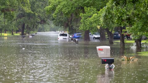 WOODLOCH, TEXAS - MAY 3: Cars are submerged and the tops of mailboxes are visible along a residential street in Woodloch near The Woodlands as floodwaters rise Friday, May 3, 2024.