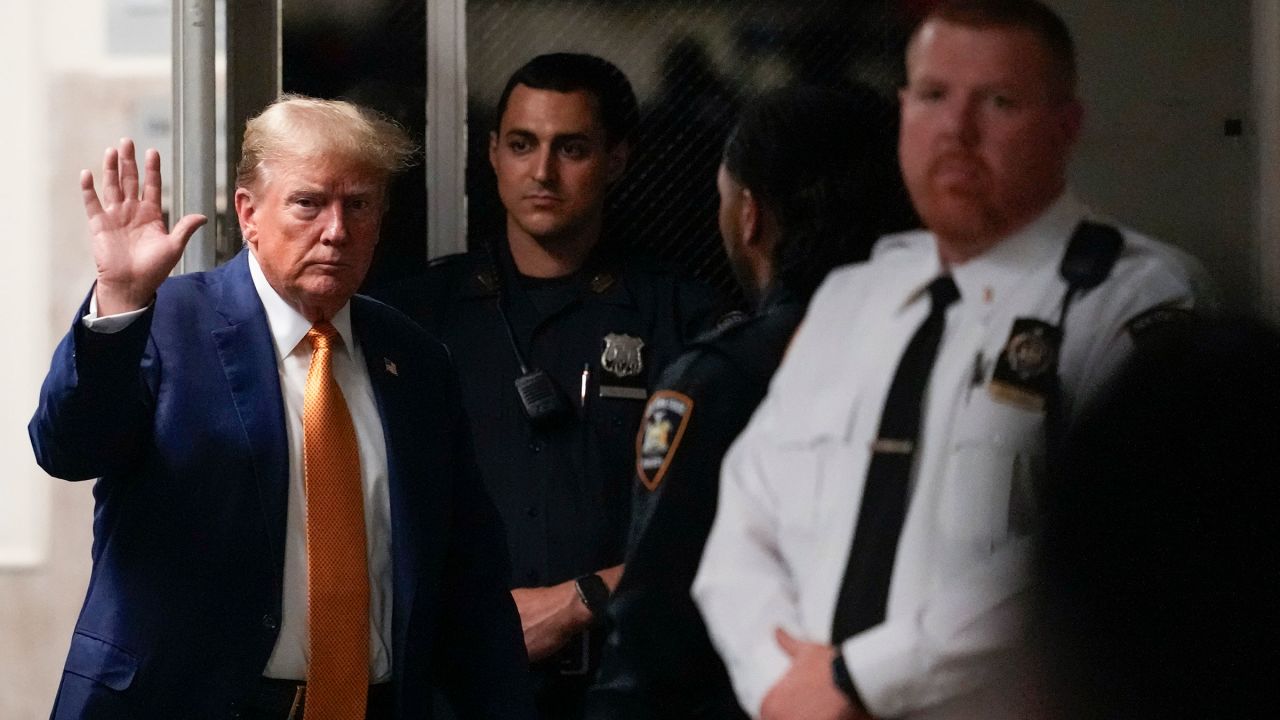 Former President Donald Trump returns from a lunch break at his trial for allegedly covering up hush money payments at Manhattan Criminal Court in New York City on May 7, 2024. Trump has been charged with 34 counts of falsifying business records, which prosecutors say was an effort to hide a potential sex scandal, both before and after the 2016 presidential election.