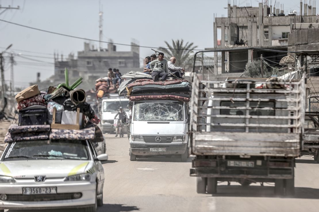Palestinians forced to evacuate eastern Rafah, on May 8, carry their belongings as Israeli forces intensified attacks on the city, in southern Gaza.