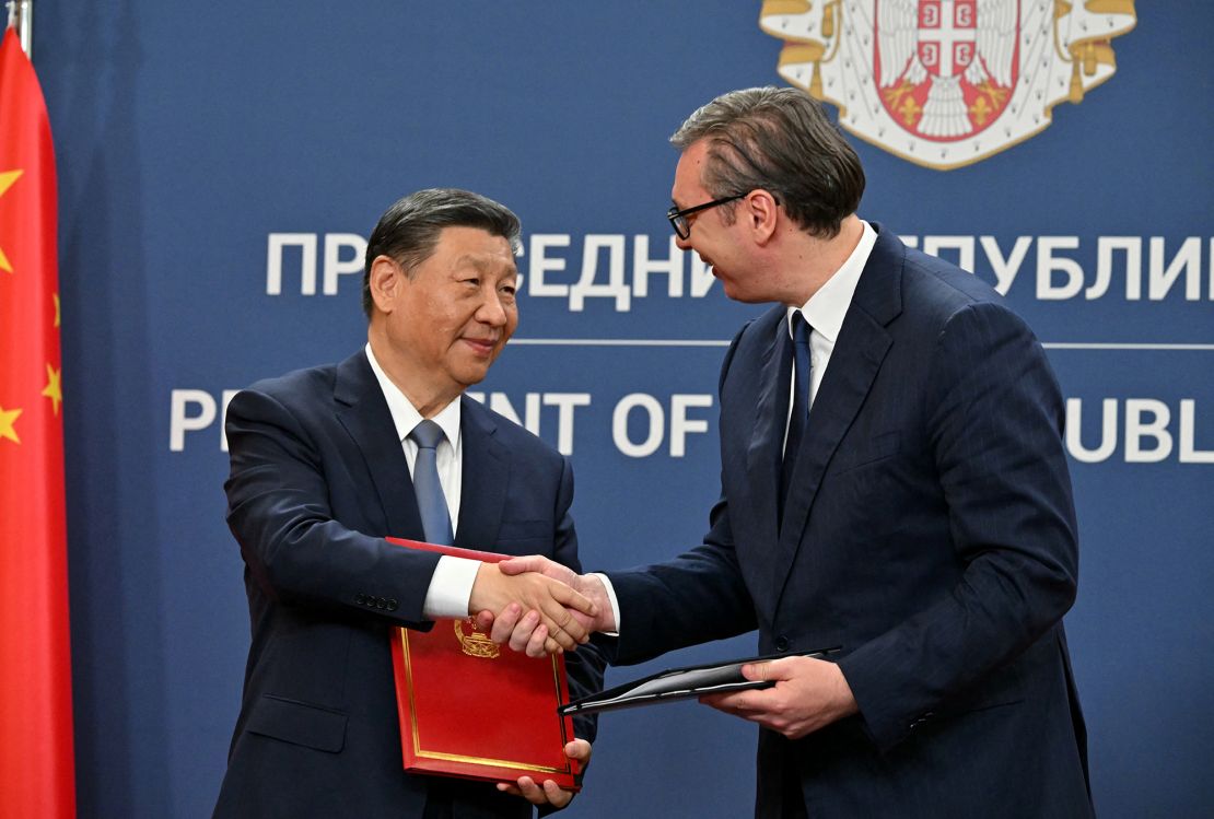 Chinese leader Xi Jinping and Serbian President Aleksandar Vucic shake hands after signing bilateral agreements during a meeting in Belgrade, on May 8, 2024.