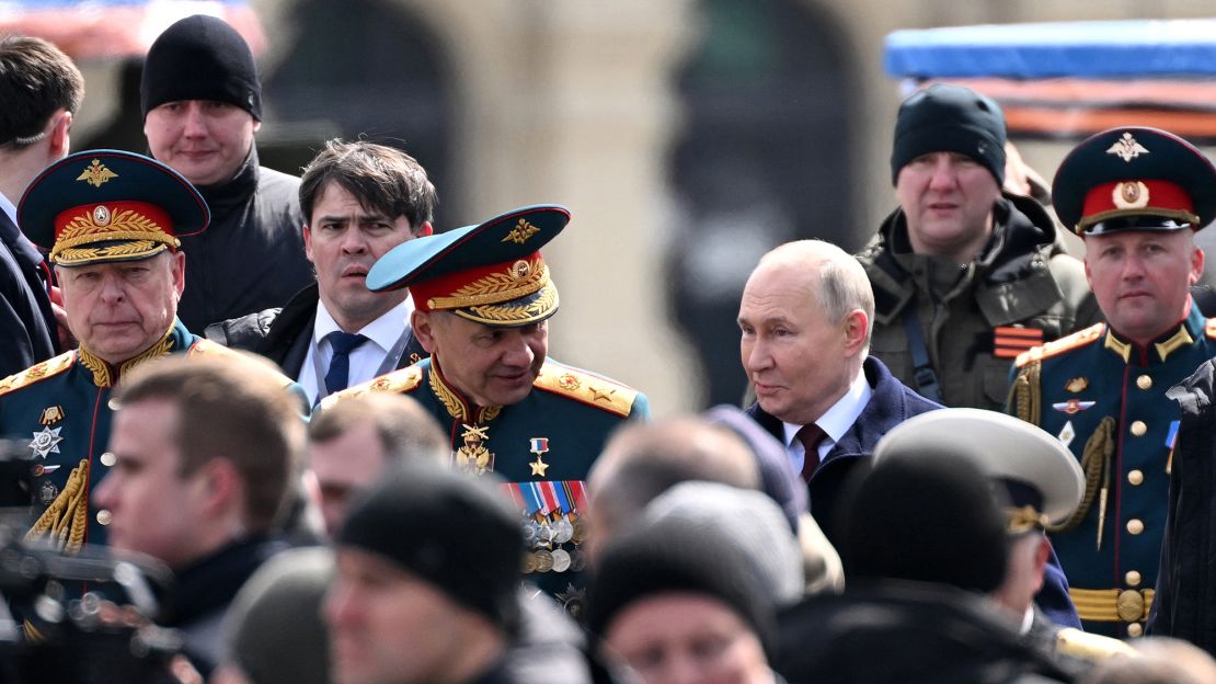 Russia's President Vladimir Putin, center-right, with Sergei Shoigu, at Red Square for the Victory Day military parade in central Moscow on May 9, 2024.