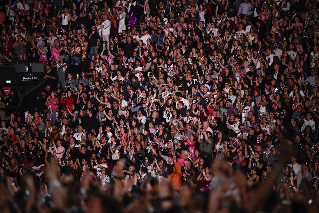 Fans watch Swift at her concert in Paris last week.