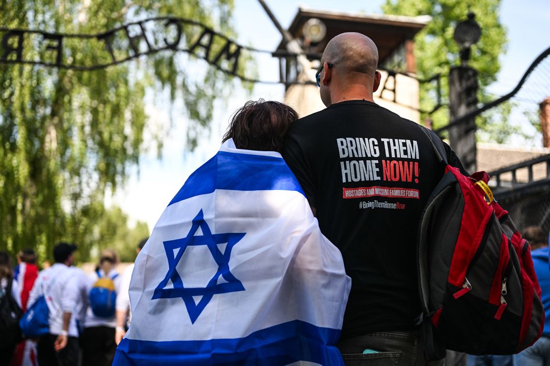 Bellha Haim, left, grandmother of Yotam Haim, rests as she takes part in the 36th March of the Living at the former Nazi Auschwitz concentration and death camp on May 6, 2024.