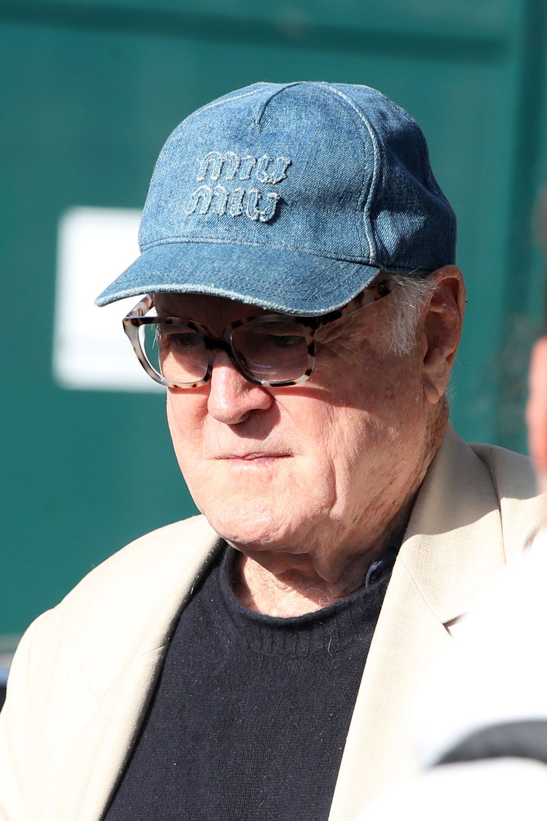 John Cleese's denim Miu Miu cap retails for $550.