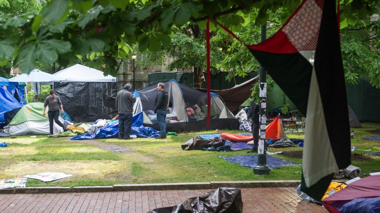 Maintenance staff and waste disposal crews clean up after police cleared a pro-Palestinian protest encampment on the campus of the University of Pennsylvania in Philadelphia, Pennsylvania on May 10, 2024.