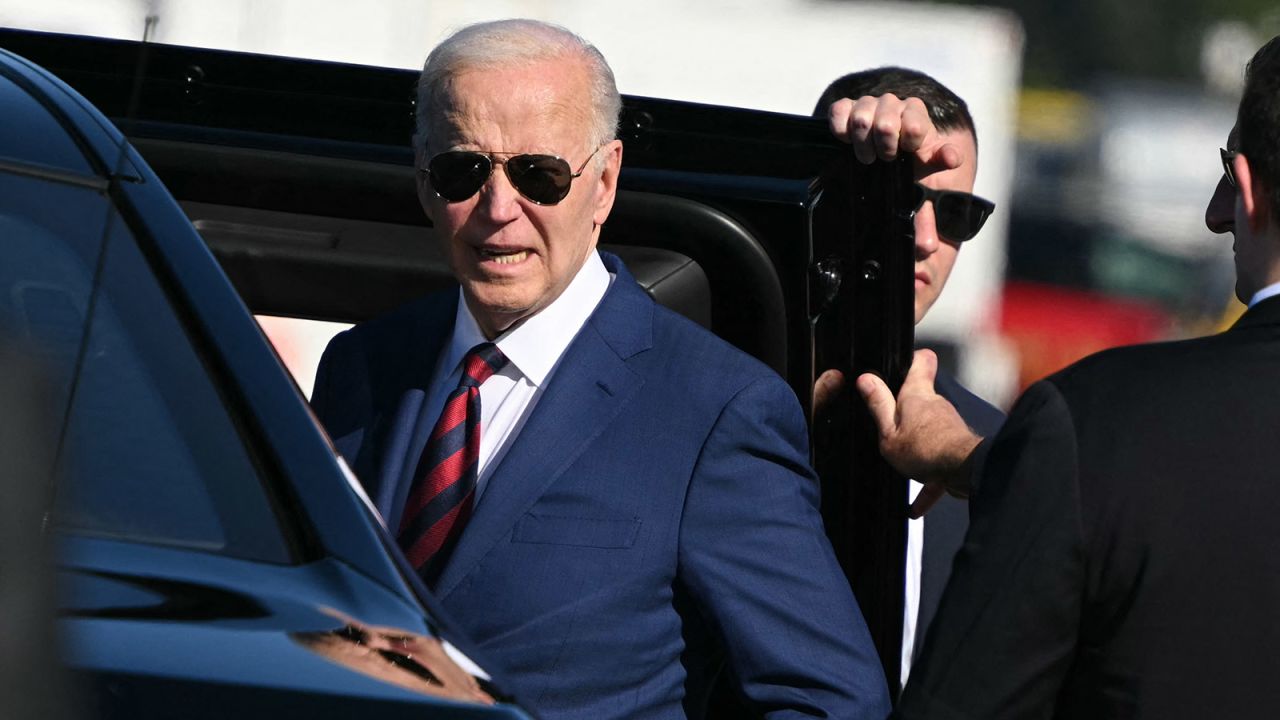 President Joe Biden listens to a question from reporters before boarding a limousine at Seattle-Tacoma International Airport, in SeaTac, Washington, on May 10, 2024.
