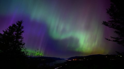 LATOURELL, OREGON - MAY 11: The Northern Lights are seen above the Columbia River Gorge from Chanticleer Point Lookout in the early morning hours of May 11, 2024 in Latourell, Oregon.  Places as far south as Alabama and parts of Northern California were expected to see the aurora borealis, also known as the northern lights from a powerful geomagnetic storm that reached Earth. (Photo by Mathieu Lewis-Rolland/Getty Images)
