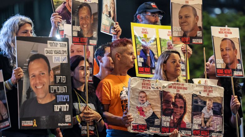 Relatives of Israeli hostages held in Gaza since the October 7 attacks hold signs during a rally calling for their release outside the Tel Aviv Museum of Art, in Tel Aviv on May 11, 2024. , amid the ongoing conflict in the Gaza Strip between Israel and Hamas.