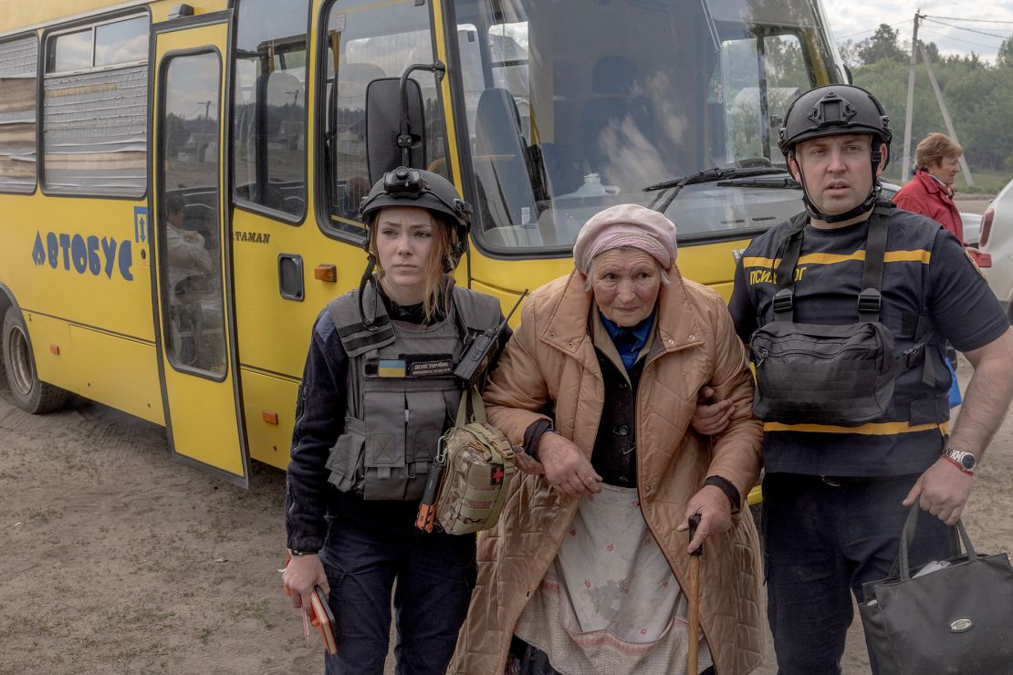 An evacuee arrives by bus at an evacuation point in Ukraine's Kharkiv region, on May 12.