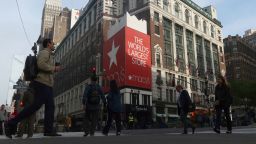 People walk along 34th street in front of the Macy's Herald Square department store on May 6 in New York.