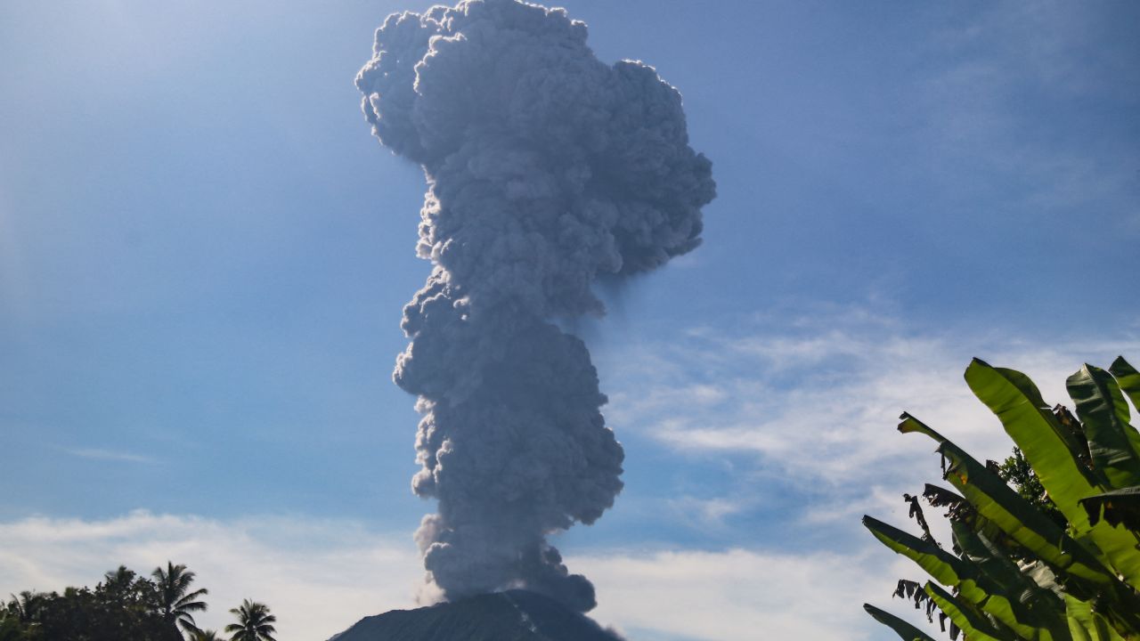 TOPSHOT - Mount Ibu spews thick smoke in Gam Ici, North Maluku, on May 13, 2024. A volcano in eastern Indonesia erupted on May 13, spewing a huge ash tower more than five kilometres (three miles) into the sky after authorities raised its alert level to the second-highest last week. (Photo by Azzam Risqullah / AFP) (Photo by AZZAM RISQULLAH/AFP via Getty Images)