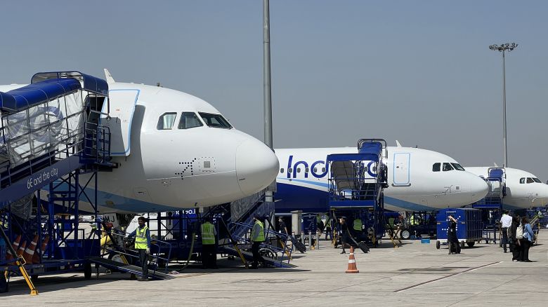 IndiGo Airlines airplanes sit on the runway at Indira Gandhi International Airport in New Delhi.