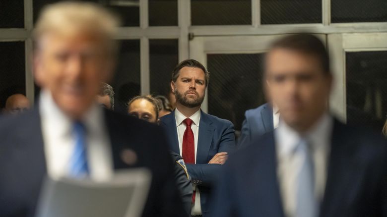 Sen. JD Vance looks on as former President Donald Trump speaks to the media during Trump's trial for allegedly covering up hush money payments at Manhattan Criminal Court on May 13, 2024 in New York City.
