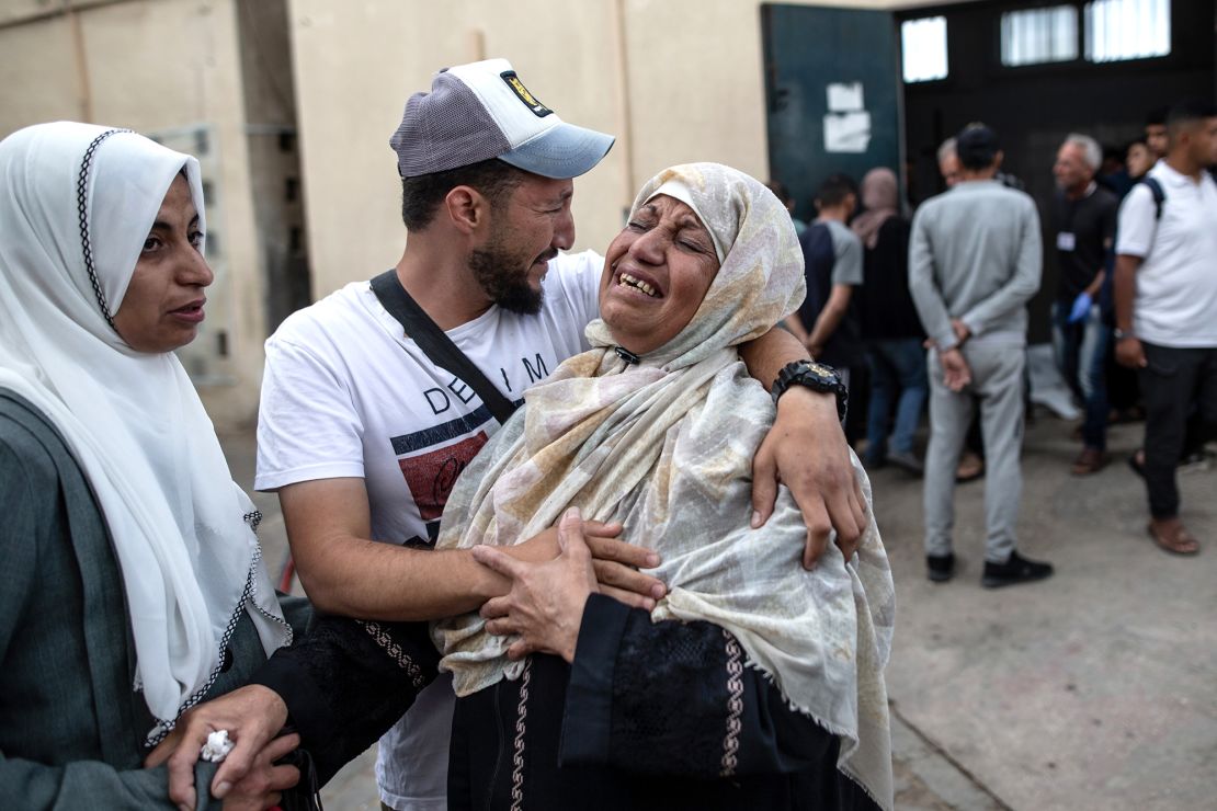 Relatives of those killed mourn on Tuesday morning.