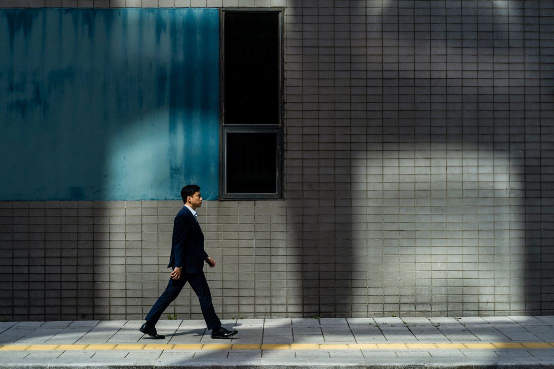 A man walks along a pavement in Seoul on May 14, 2024.