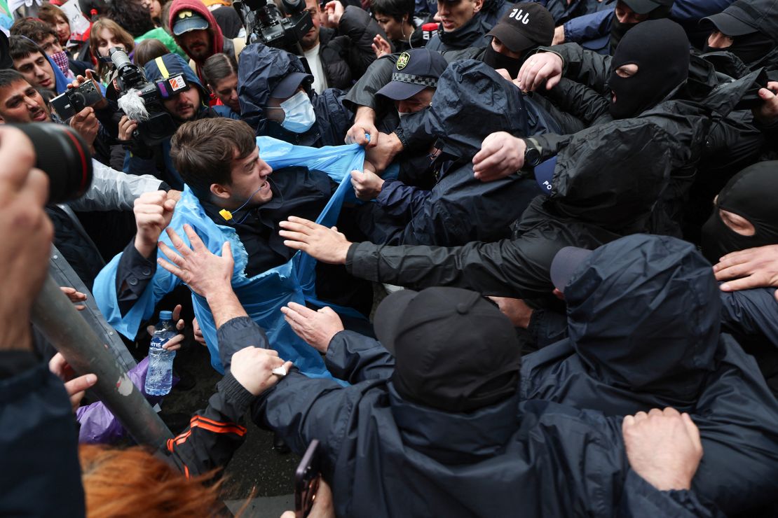 Georgian law enforcement officers detain a demonstrator near the parliament in Tbilisi on May 14.