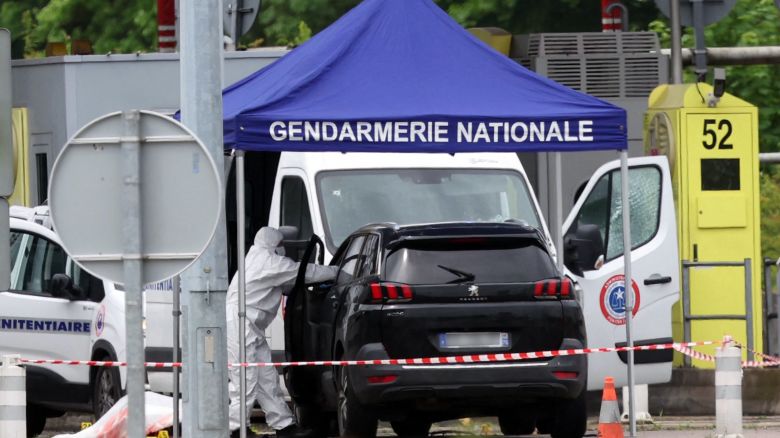 TOPSHOT - A forensic is at work at the site of a ramming attack which took place late morning at a road toll in Incarville in the Eure region of northern France, on May 14, 2024. Two French prison officers were killed and two others wounded on May 14 in an attack on a prison van transporting an inmate who escaped, a police source told AFP. (Photo by ALAIN JOCARD / AFP) (Photo by ALAIN JOCARD/AFP via Getty Images)