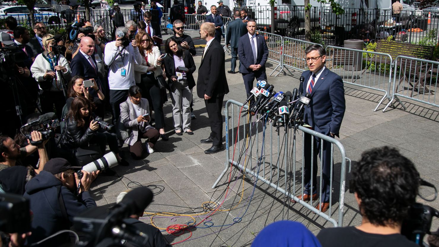 House Speaker Mike Johnson speaks to the media outside Manhattan criminal court on May 14, 2024.