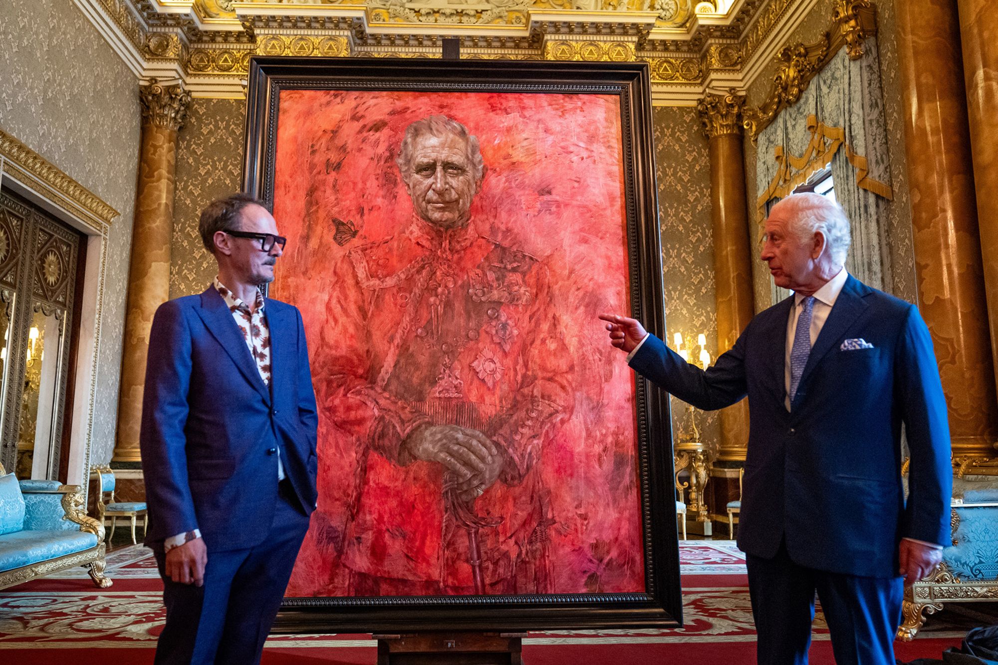 Britain's King Charles III, right, stands alongside artist Jonathan Yeo after unveiling an official portrait of himself wearing the uniform of the Welsh Guards, of which the King was made Regimental Colonel in 1975.