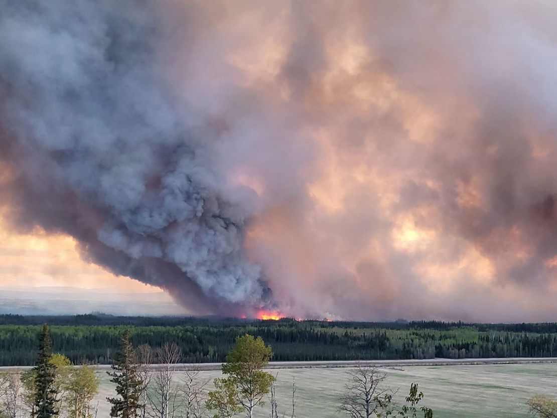 Smoke rises from a wildfire burning near Fort Nelson on May 14.