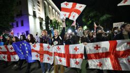 Protesters rally against the "foreign influence" law outside the parliament in Tbilisi on May 15, 2024. Georgians took to the streets on May 15, 2024 in the latest round of a weeks-long mass protest against a "foreign influence" law whose adoption by Georgia has prompted a blizzard of international condemnation. Ruling Georgian Dream party lawmakers voted through the legislation on May 14, 2024 in defiance of protesters worried the Caucasus country is shifting away from a pro-Western course towards Russia. (Photo by Giorgi ARJEVANIDZE / AFP) (Photo by GIORGI ARJEVANIDZE/AFP via Getty Images)