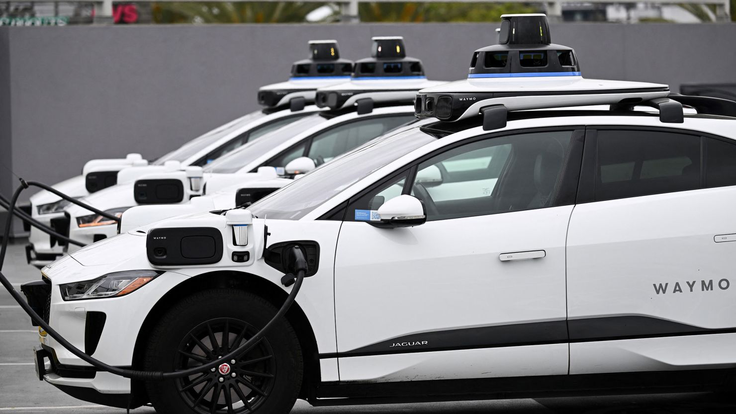 A Waymo self-driving electric vehicle is parked in Los Angeles, California, on May 15, 2024.