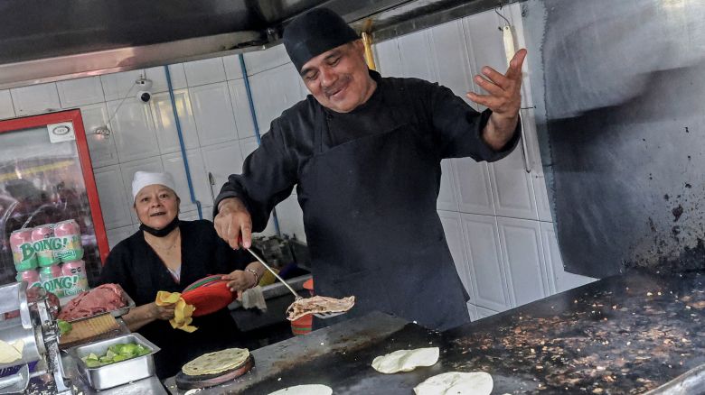 Chef Arturo Rivera Martinez prepares tacos at Taqueria El Califa de Leon restaurant in Mexico City on May 15, 2024. A hole-in-the-wall taqueria is among the first restaurants in Mexico to be awarded a star by the prestigious Michelin Guide -- an accomplishment its owner credits to "love and effort".