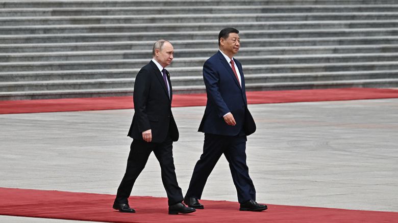 Russia's President Vladimir Putin and Chinese leader Xi Jinping attend an official welcoming ceremony in front of the Great Hall of the People in Tiananmen Square in Beijing on May 16.