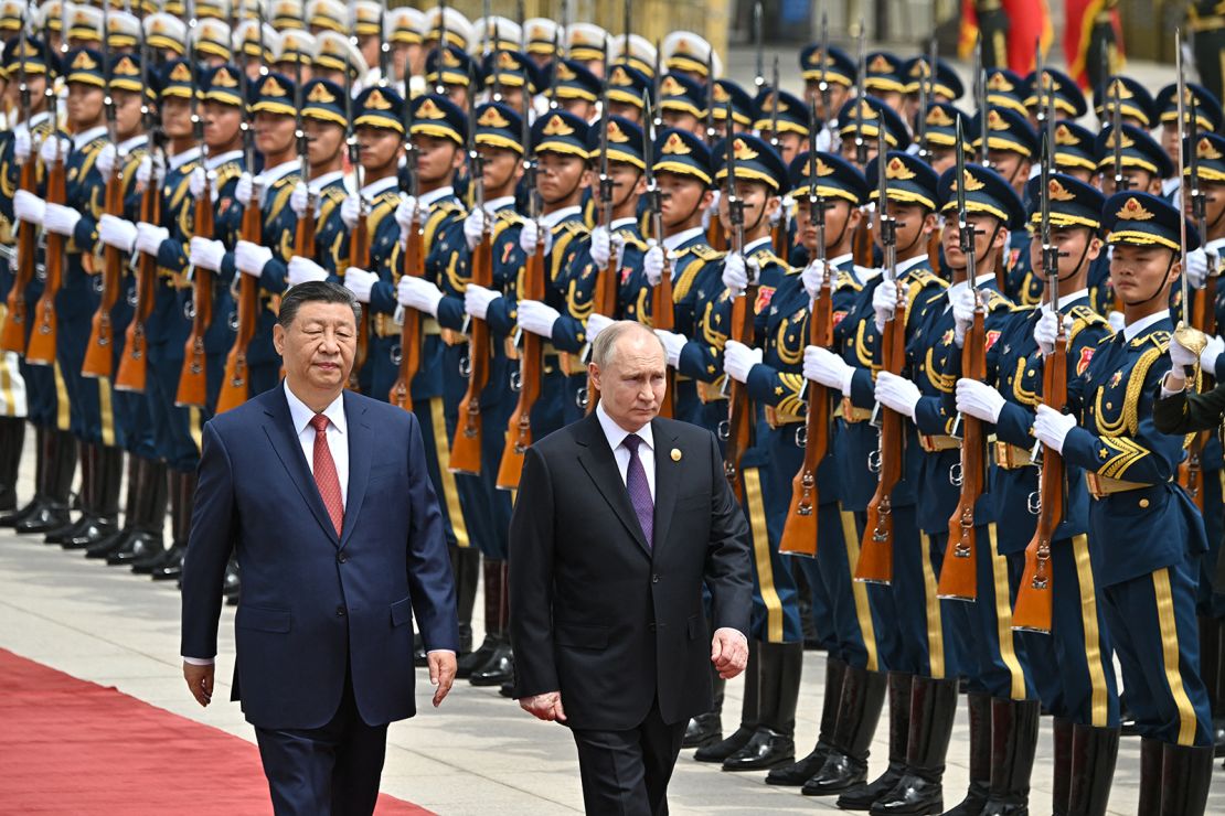 Russia's President Vladimir Putin and China's leader Xi Jinping attend an official welcoming ceremony in front of the Great Hall of the People in Tiananmen Square in Beijing on May 16, 2024.