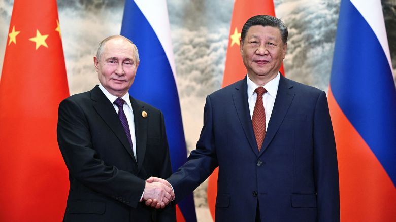 TOPSHOT - In this pool photograph distributed by the Russian state agency Sputnik, Russia's President Vladimir Putin (L) and China's President Xi Jinping shake hands prior to their talks in Beijing on May 16, 2024. (Photo by Sergei GUNEYEV / POOL / AFP) / ** Editor's note : this image is distributed by Russian state owned agency Sputnik ** (Photo by SERGEI GUNEYEV/POOL/AFP via Getty Images)