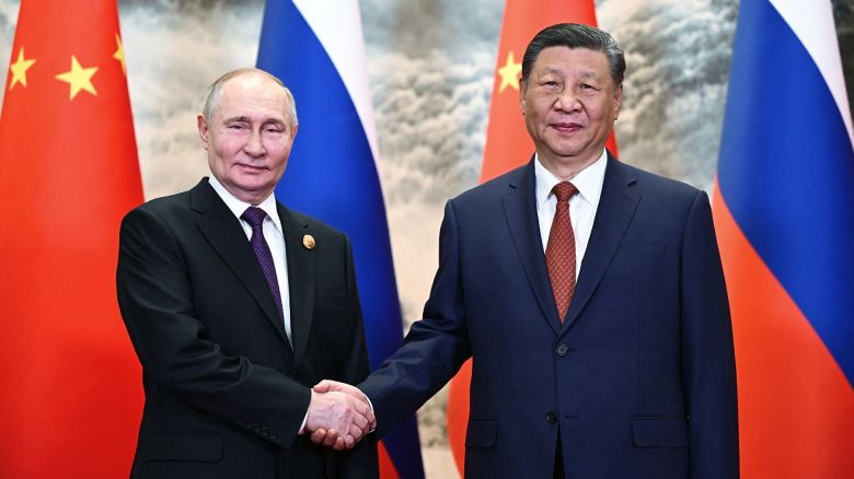 TOPSHOT - In this pool photograph distributed by the Russian state agency Sputnik, Russia's President Vladimir Putin (L) and China's President Xi Jinping shake hands prior to their talks in Beijing on May 16, 2024. (Photo by Sergei GUNEYEV / POOL / AFP) / ** Editor's note : this image is distributed by Russian state owned agency Sputnik ** (Photo by SERGEI GUNEYEV/POOL/AFP via Getty Images)