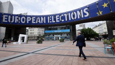 Pedestrians walk past a banner displayed on the building of the European Parliament in Brussels, on May 17, 2024, ahead of the European elections scheduled between June 6 and June 9, 2024. (Photo by Kenzo TRIBOUILLARD / AFP) (Photo by KENZO TRIBOUILLARD/AFP via Getty Images)