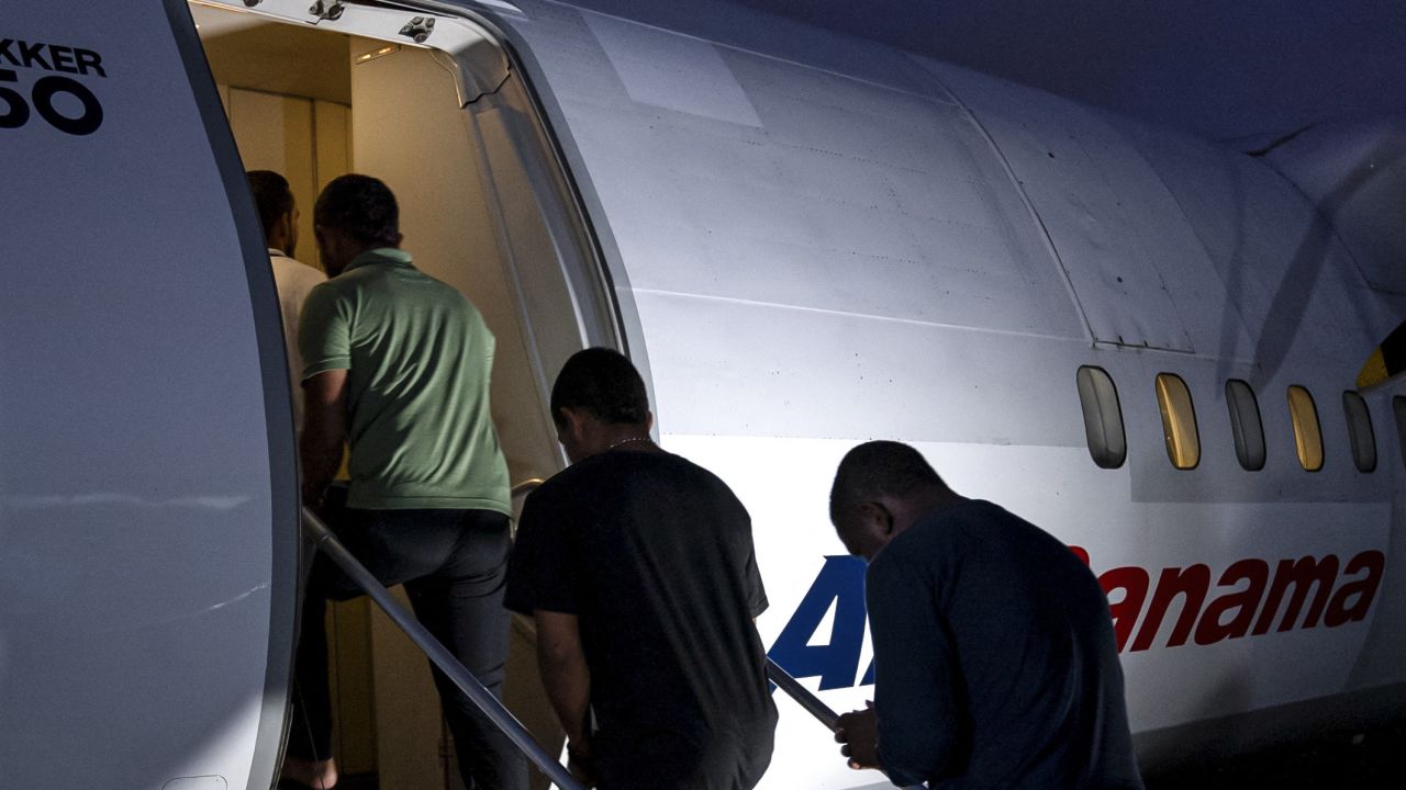 Colombian citizens board a chartered flight as they are deported in Albrook Gelabert airport in Panama City May 17 2024. Panama deported on May 17, 30 Colombian citizens, which according to Panama's Migration Director Samira Gozaine, have criminal records and entered Panama by crossing the inhospitable Darien jungle like thousands of other migrants heading to the United States. (Photo by Ivan PISARENKO / AFP) (Photo by IVAN PISARENKO/AFP via Getty Images)