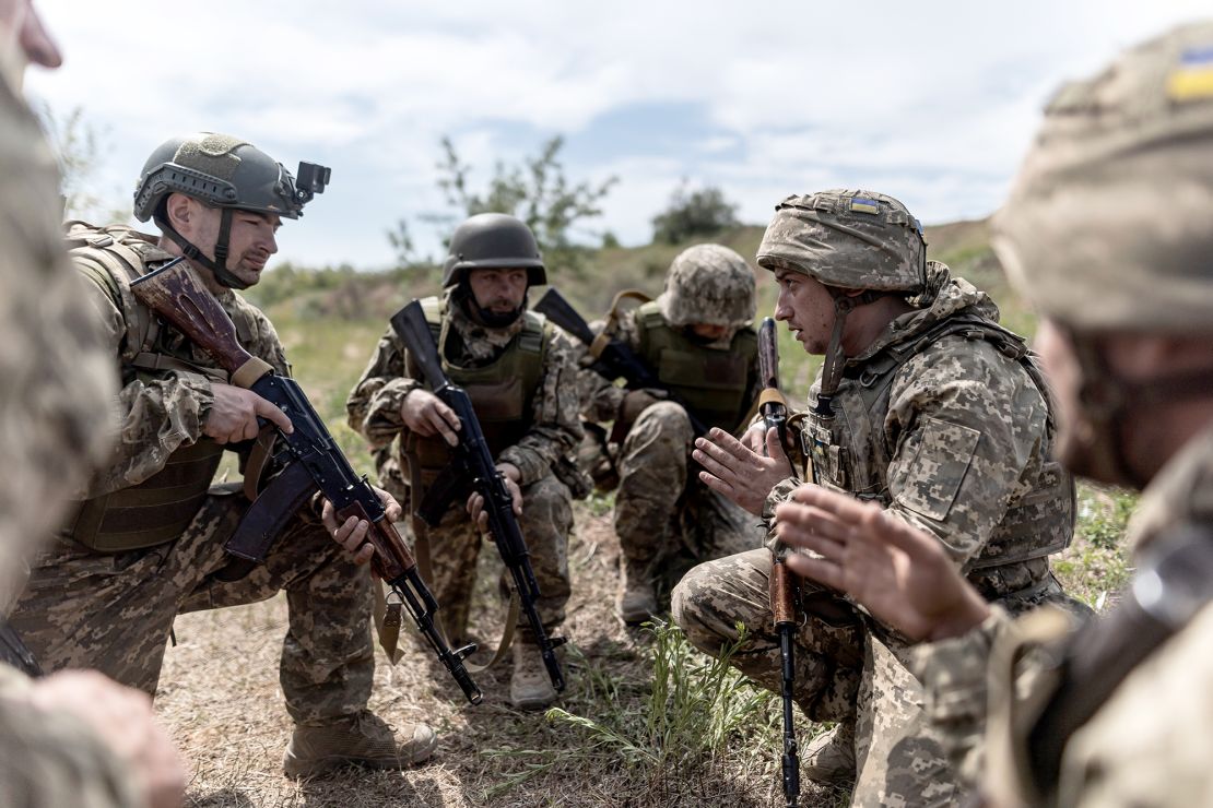 Ukrainian soldiers listen to instructions during training at an undetermined location in Donetsk Oblast, Ukraine on May 18, 2024.