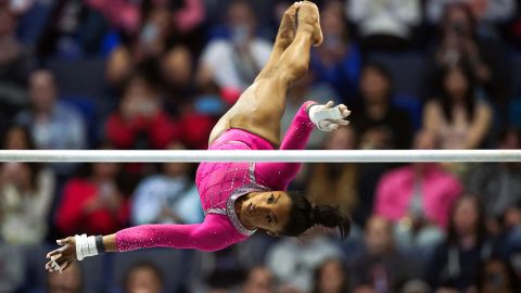 TOPSHOT - US gymnast Simone Biles competes in the uneven bars event during the Core Hydration Classic at XL Center in Hartford, Connecticut, on May 18, 2024. (Photo by Charly TRIBALLEAU / AFP) (Photo by CHARLY TRIBALLEAU/AFP via Getty Images)