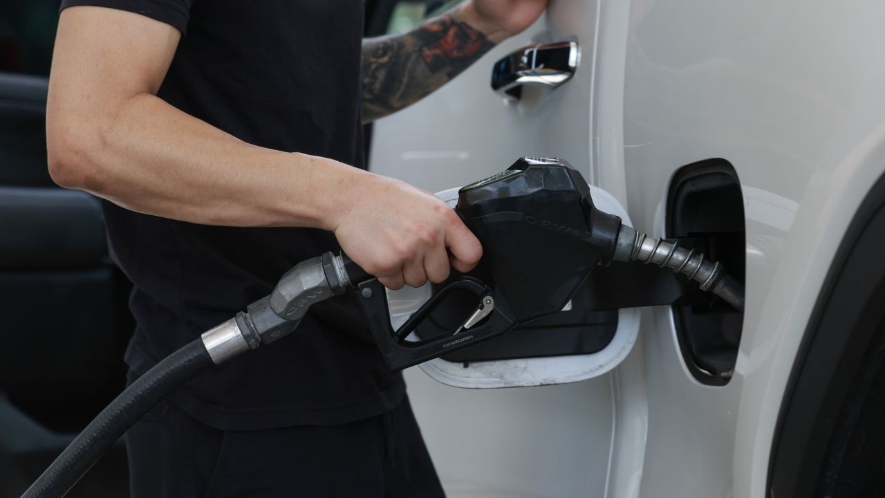 A customer gets gas at a Shell station on May 15, 2024 in Miami, Florida.