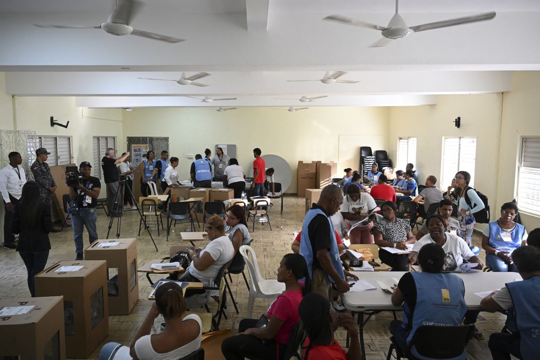 Electoral employees count votes during the general elections in Santo Domingo on May 19, 2024.