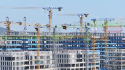 Tower cranes are seen at a real estate construction site in Yantai, Shandong province, China, May 19, 2024.