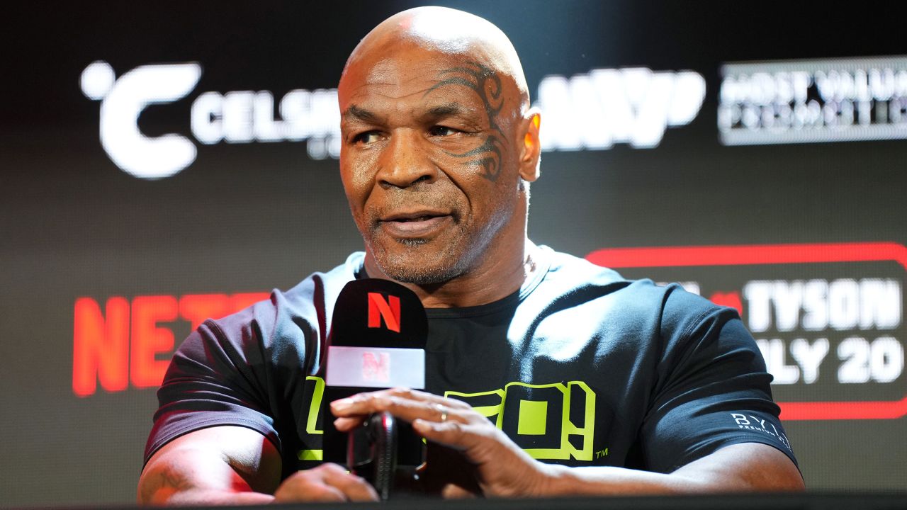ARLINGTON, TEXAS - MAY 16: Mike Tyson speaks onstage during the Jake Paul vs. Mike Tyson Boxing match Arlington press conference at Texas Live! on May 16, 2024 in Arlington, Texas.  (Photo by Cooper Neill/Getty Images for Netflix)