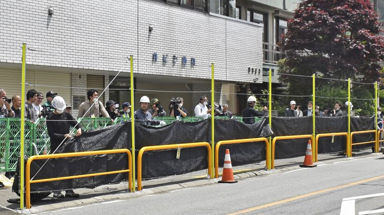 Workers begin setting up a large black screen in Fujikawaguchiko on May 21, 2024.